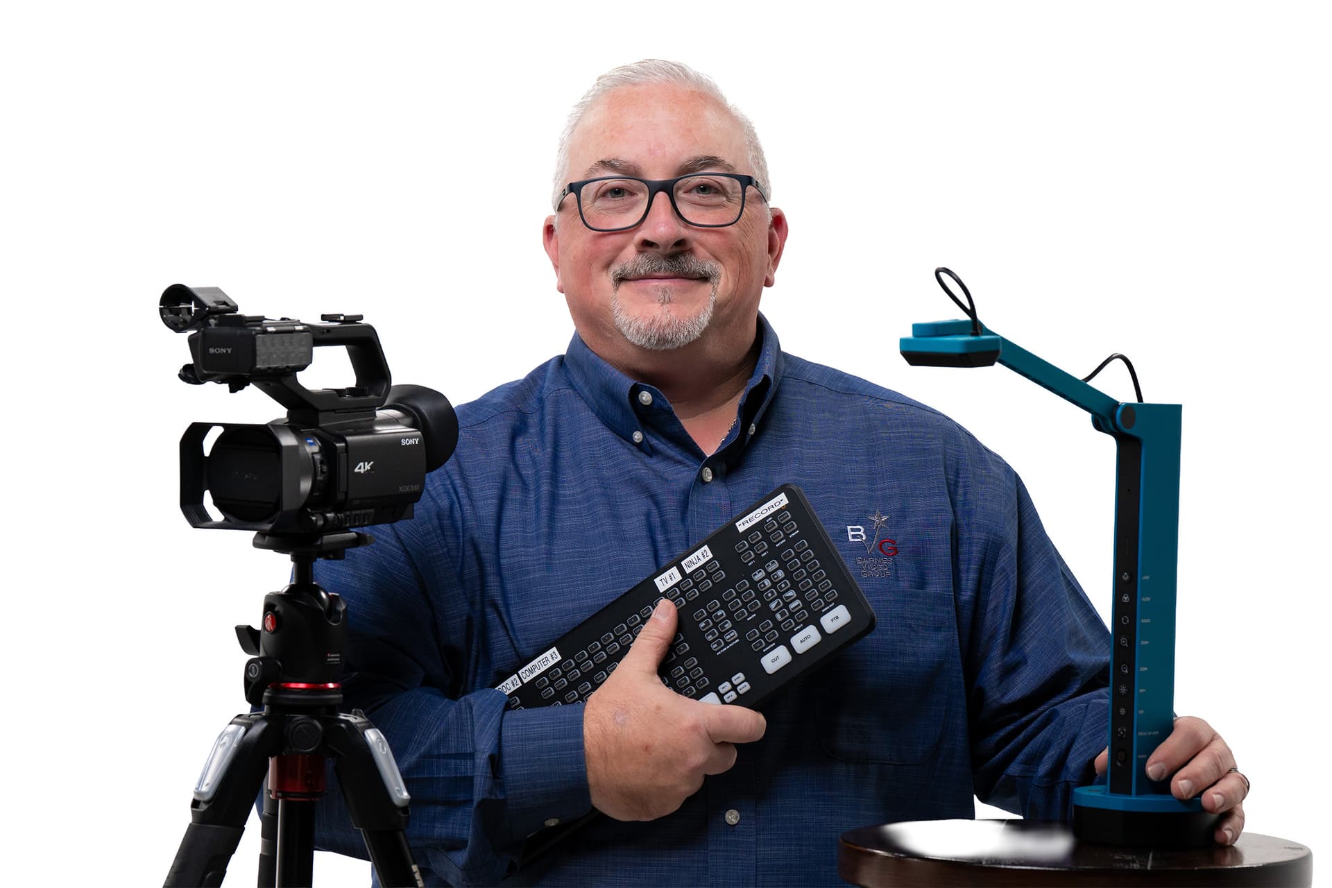 Barnes Video Group videographer holding legal videography equipment and document camera