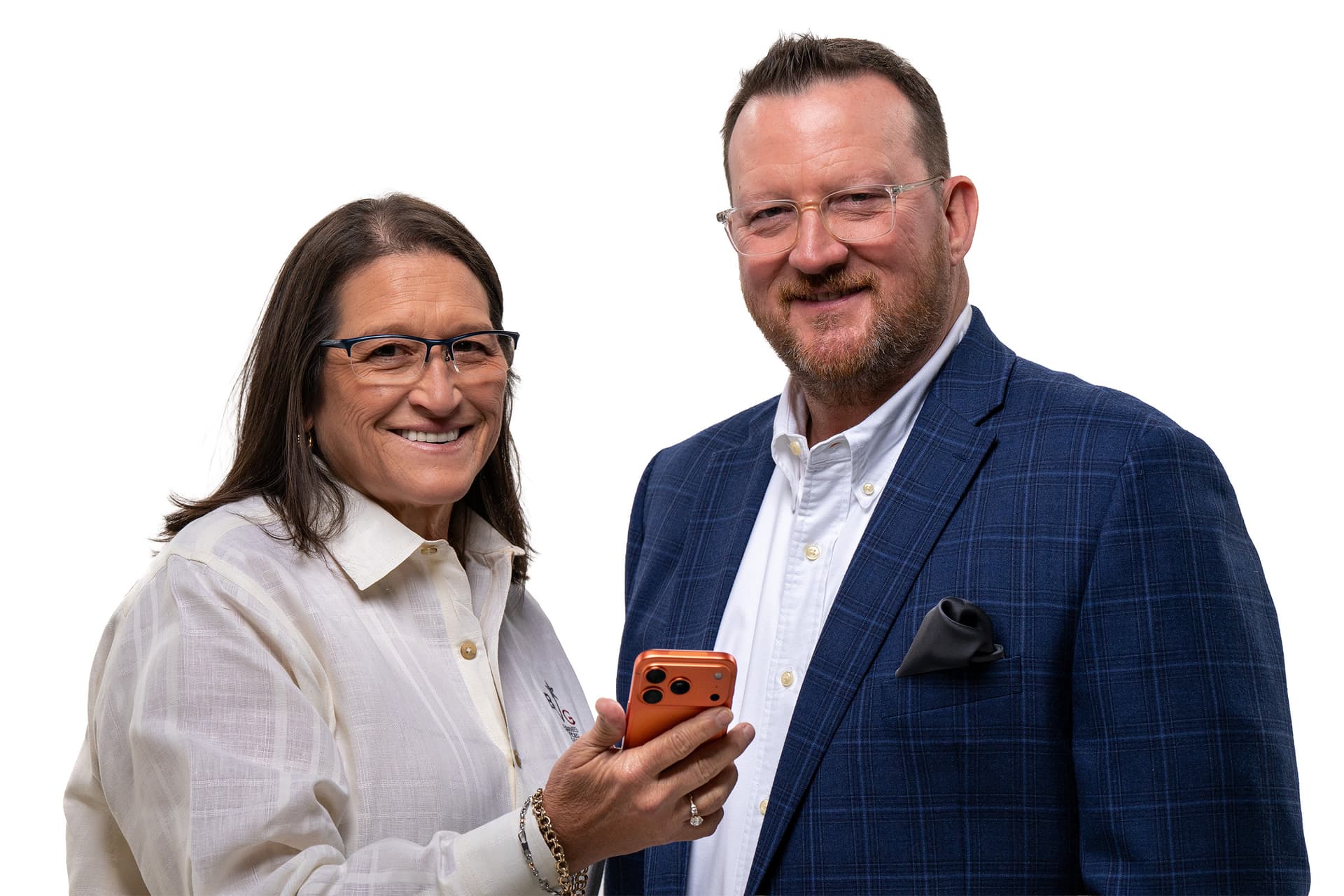 Barnes Video Group owner Michael Barnes and employee holding a smart phone